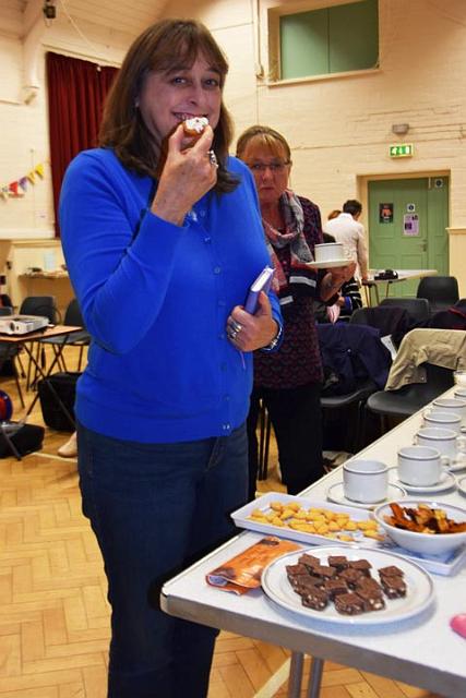 Priscilla tests the cakes.jpg